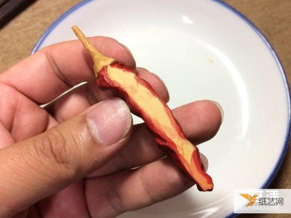 It’s so similar! A small wooden carving of dried fish whose teeth were accidentally bitten off