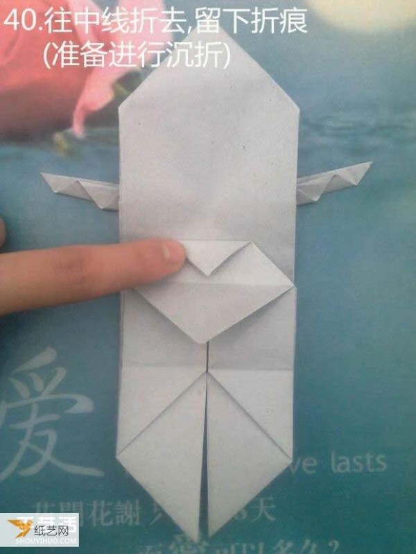 Detailed illustration of a sculpture of a pensive thinker using origami