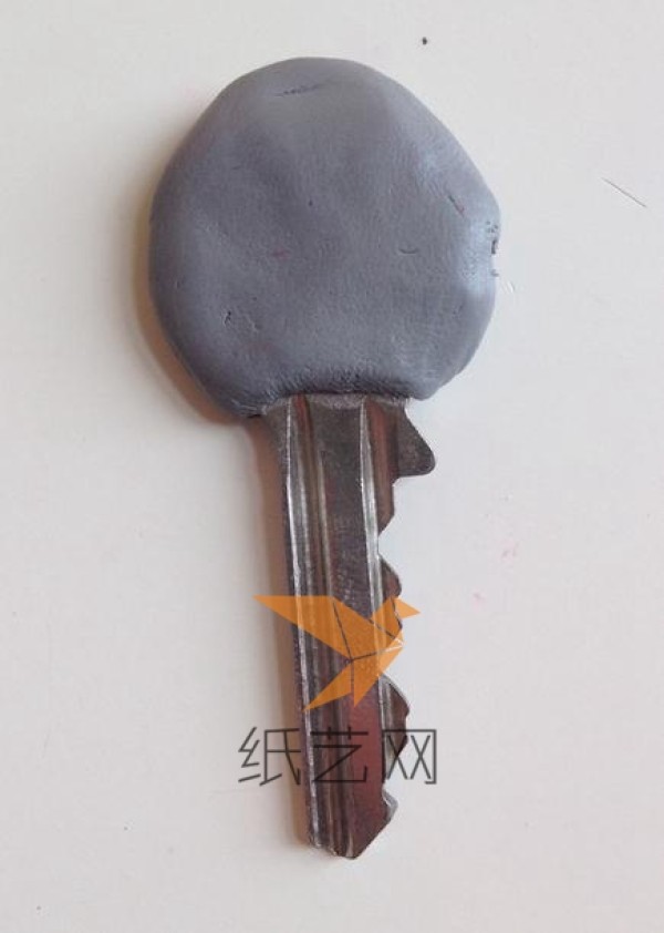 Kitten shaped key decoration made from clay