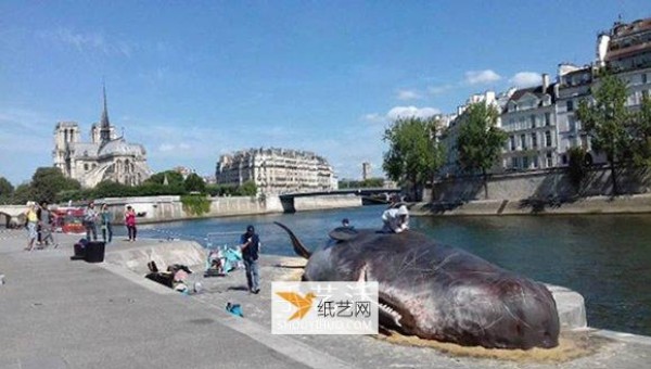 Stunning installation art! Sperm whale stranded on the banks of the Seine