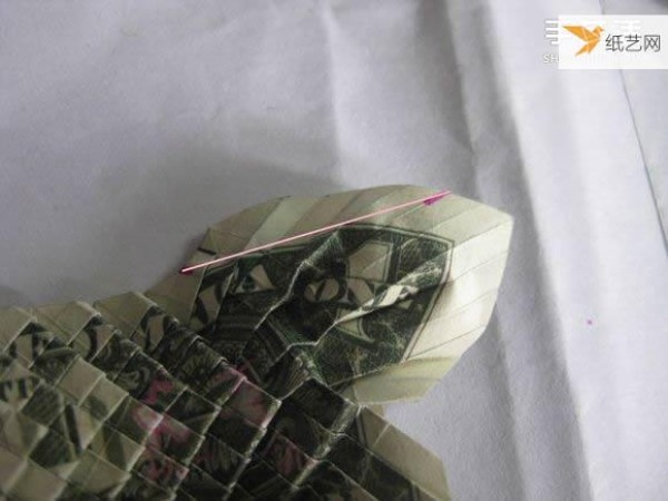 How to fold paper carp using dollars