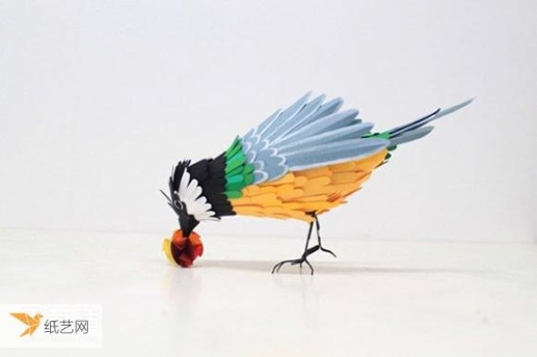 Really immerse yourself in the world of singing birds and fragrant flowers. A realistic handmade paper bird picture