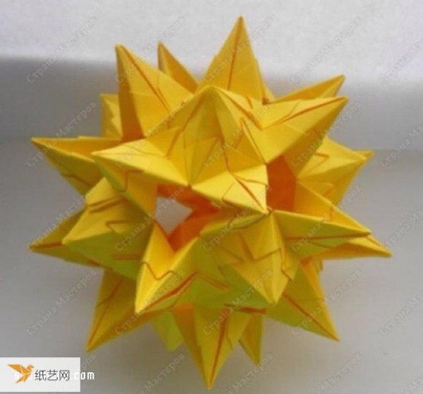 Detailed step-by-step illustration of how to fold a seemingly complicated origami flower ball