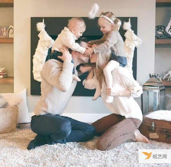 A creative family photo taken by a family of four wearing parent-child clothes