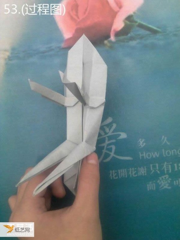 Detailed illustration of using origami to fold a sculpture of a meditative thinker