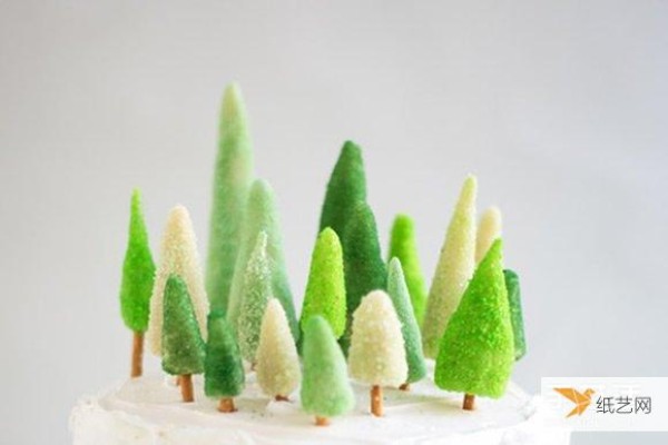 Decorated birthday cake with your own homemade mini candy Christmas tree