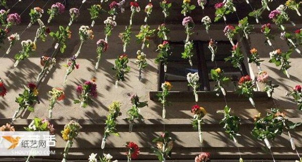 Milan designer woven 2,000 flowers into a curtain to decorate the exterior wall