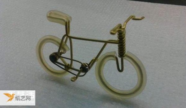 Illustrated tutorial for making a compact bicycle by hand using copper wire