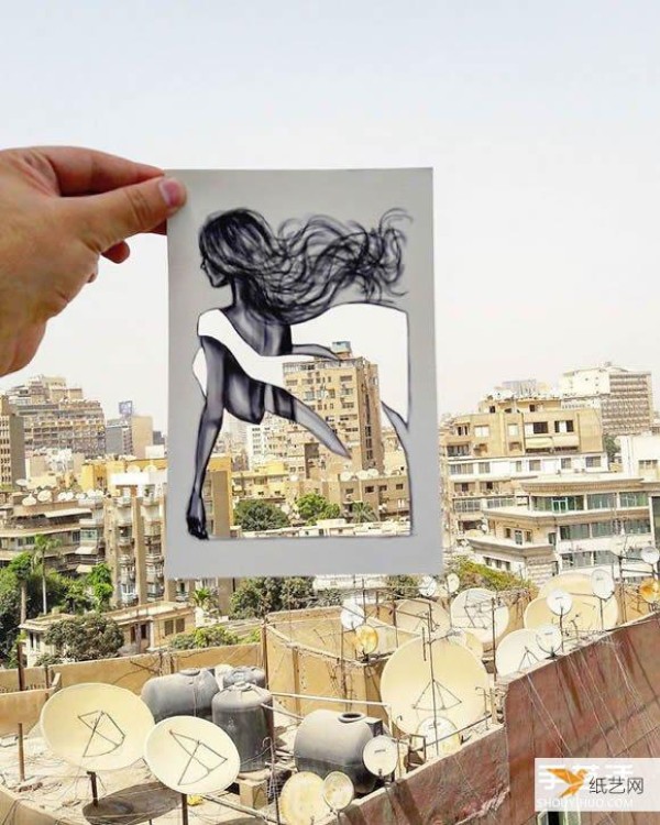 A very unique and creative paper-cut painting that puts the world into a dress!