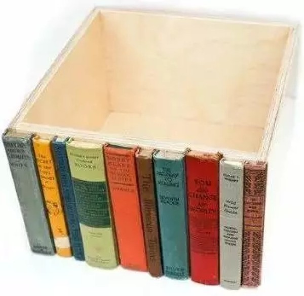 The storage box made of old books looks like a few books standing there. It’s so camouflaged!