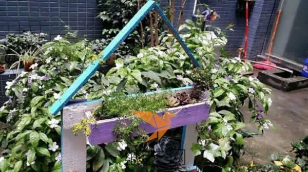 Consignment wooden boxes transformed into creative flower pots