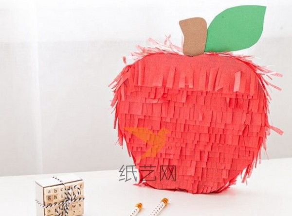 Turn waste into treasure by using old cartons to make Christmas paper apples