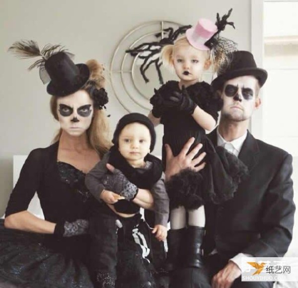 A creative family photo taken by a family of four wearing parent-child clothes