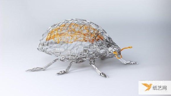 Handmade gold-coated silver wire sculptures entwine the elegant soul of animals