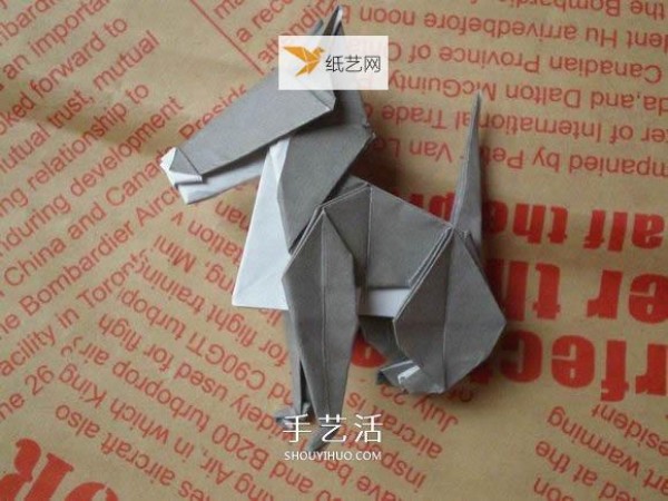 Illustration of hand folding cute puppy using origami