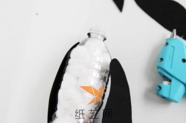 Tutorial for children to turn empty water bottles into treasures and make cute Antarctic penguins