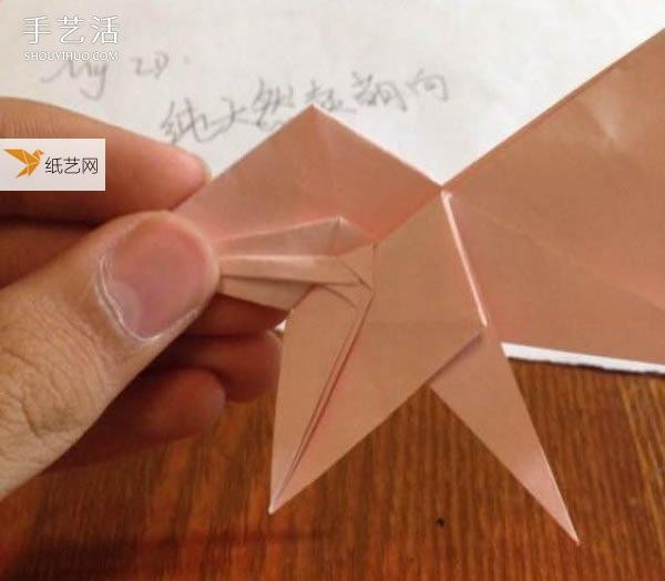 Illustration of how to fold a three-dimensional poodle using origami