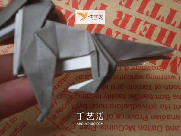 Illustration of hand folding cute puppy using origami