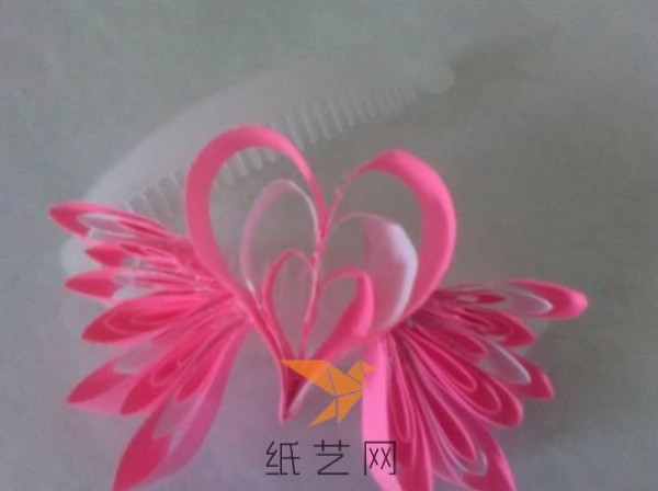 Tutorial on how to make a paper-quilled heart with wings for Valentine’s Day