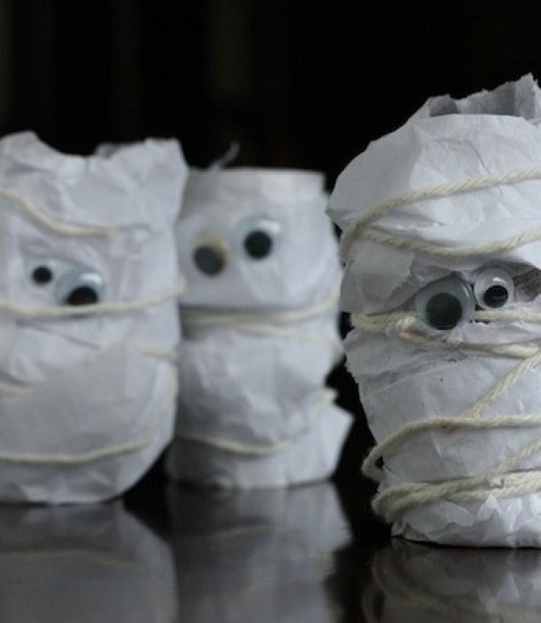 Childrens handicrafts turn waste into treasure by transforming old paper tubes into Halloween mummies