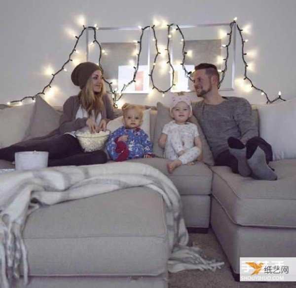 A creative family photo taken by a family of four wearing parent-child clothes