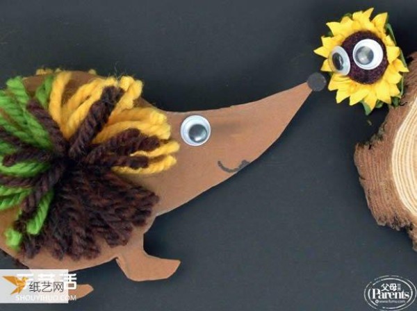 Kindergarten children make cardboard hedgehog handicrafts