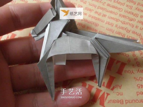 Illustration of hand folding cute puppy using origami