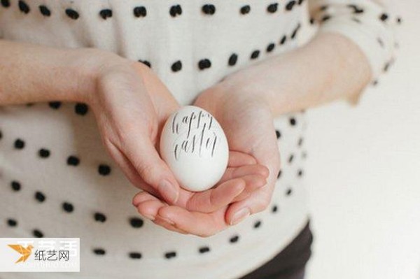 Use watercolor paint and tattoo stickers to create personalized egg decorations