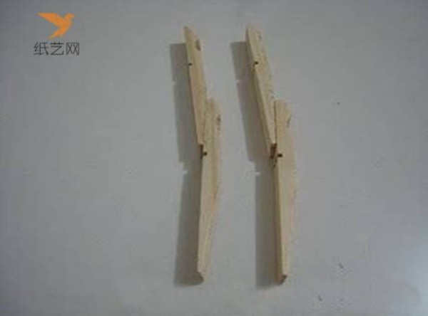 A small wooden chair for dolls made from unused wooden clips in the tutorial on turning waste into treasure