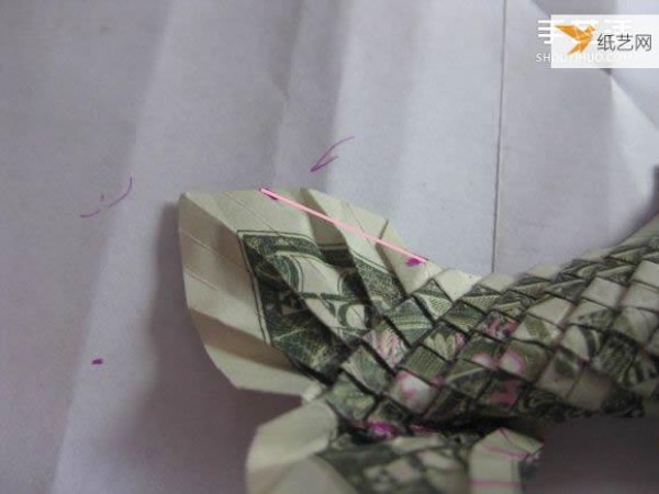 How to fold paper carp using dollars