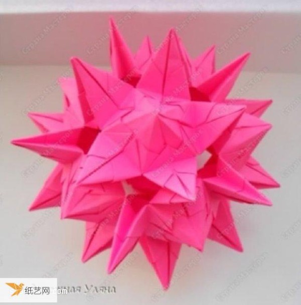 Detailed step-by-step illustration of how to fold a seemingly complicated origami flower ball