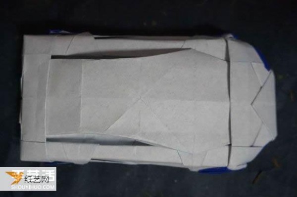 Illustrated tutorial that comprehensively demonstrates the method of hand-folding a paper sports car