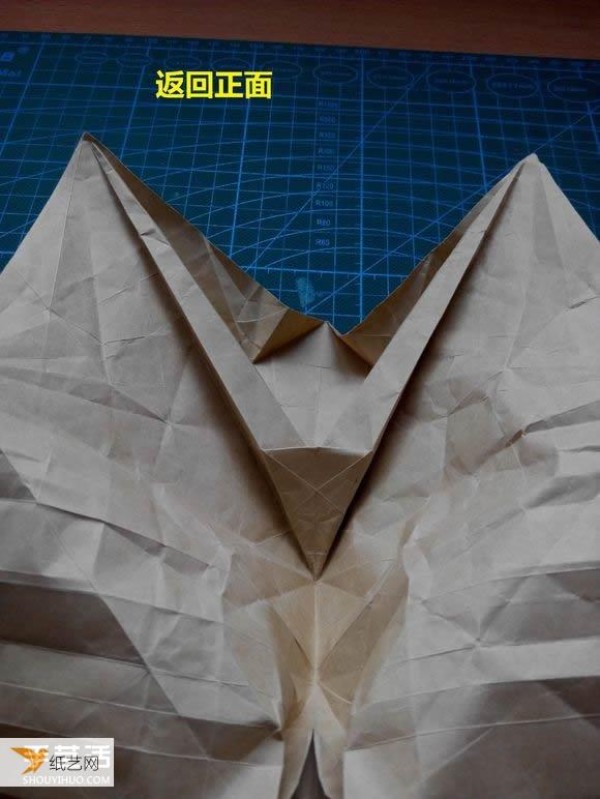 Detailed step-by-step illustration of using origami to fold a complex three-dimensional rabbit head