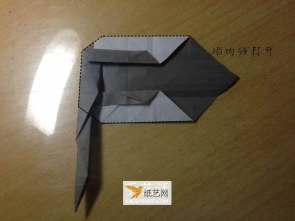 Illustration of the manual folding method of a small origami excavator