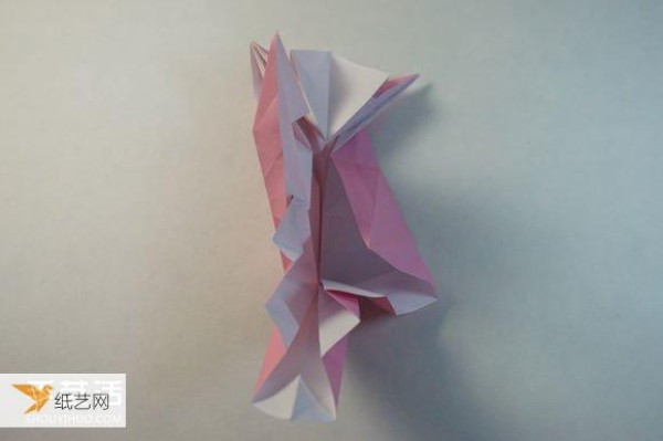 Illustrated step-by-step tutorial for girls using origami to fold something that looks complicated