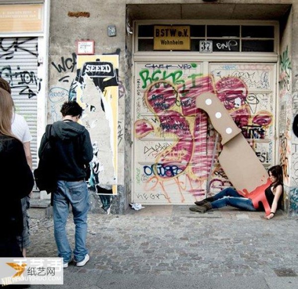 Street art is back with a giant knife made from cardboard