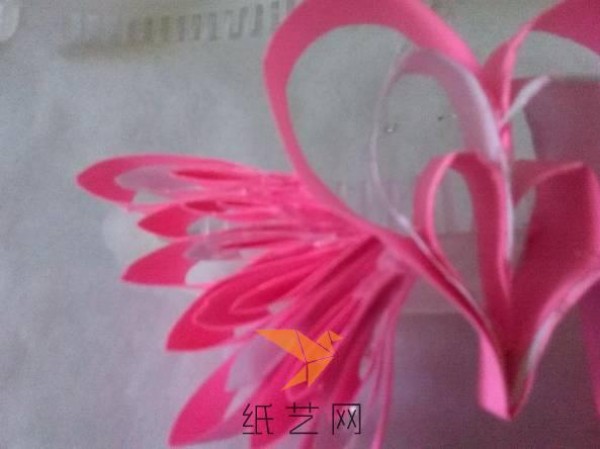 Tutorial on how to make a paper-quilled heart with wings for Valentine’s Day