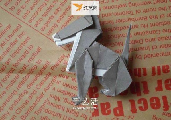 Illustration of hand folding cute puppy using origami