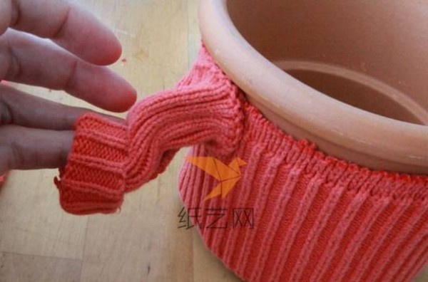 Turn waste into treasure by transforming old sweaters into small Christmas flower pot decorations