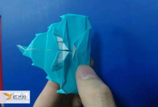 Illustrated step-by-step tutorial for making handmade cartoon poop using origami