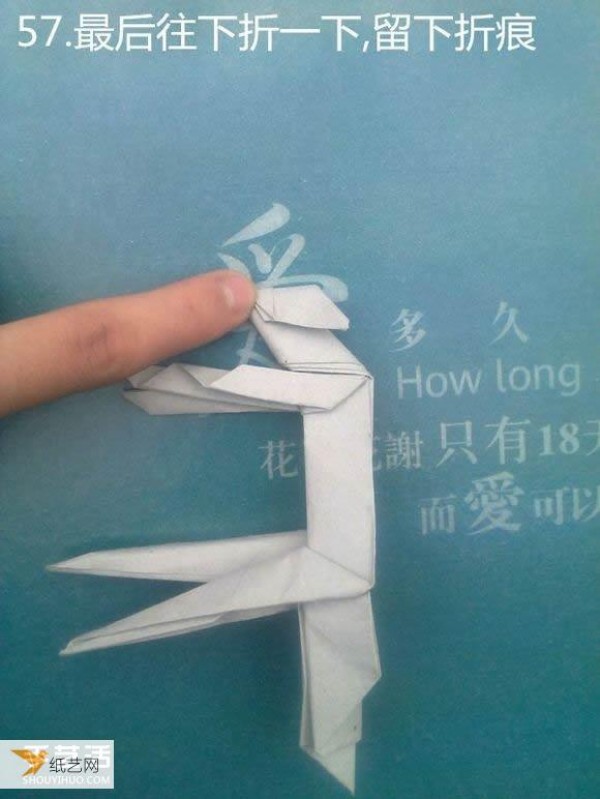 Detailed illustration of using origami to fold a sculpture of a meditative thinker