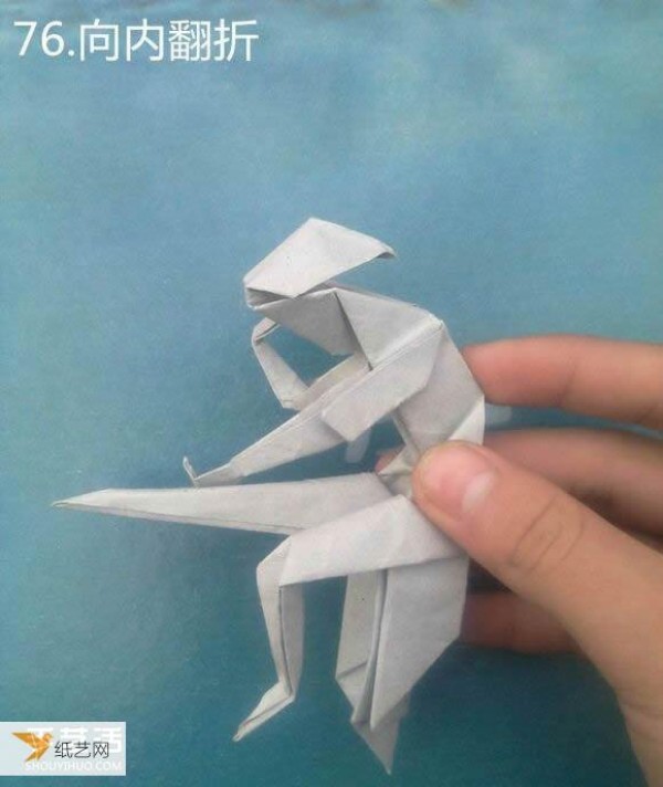 Detailed illustration of a sculpture of a pensive thinker using origami