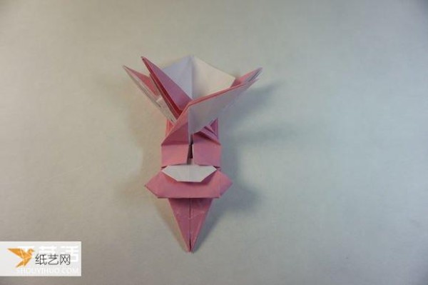 Illustrated step-by-step tutorial for girls using origami to fold something that looks complicated