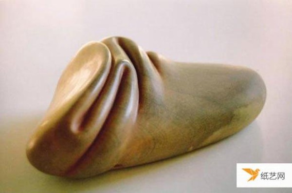 A pair of skillful hands create stone sculptures with smooth and natural curves