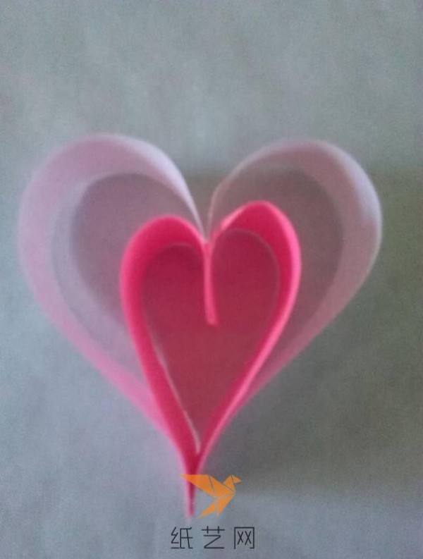 Tutorial on how to make a paper-quilled heart with wings for Valentine’s Day