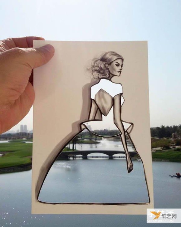 A very unique and creative paper-cut painting that puts the world into a dress!