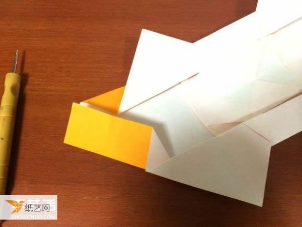 Illustrated tutorial that comprehensively demonstrates the method of hand-folding a paper sports car