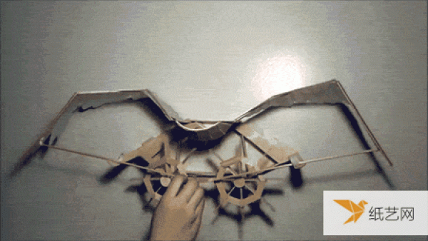 dynamic mechanism made from popsicle sticks and mylar