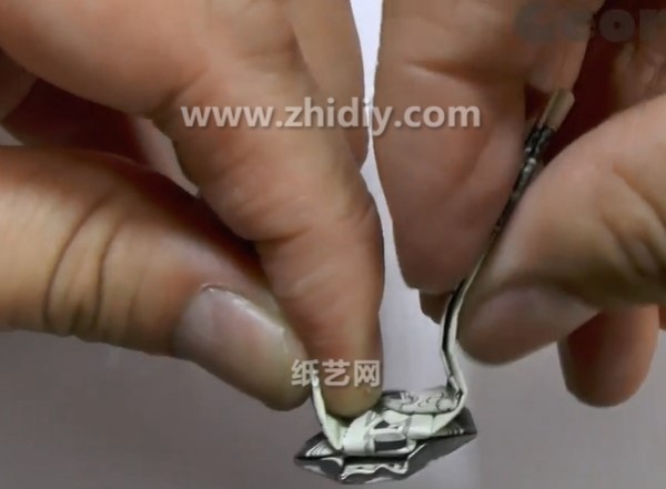 How to fold a dollar origami ring by hand