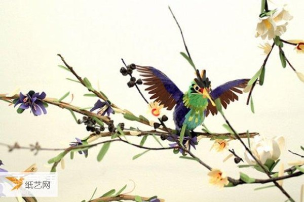 Really immerse yourself in the world of singing birds and fragrant flowers. A realistic handmade paper bird picture